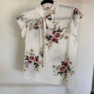 Floral blouse with shoulder ruffle and neck tie